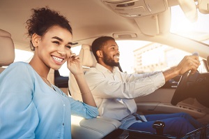 image of couple driving a car