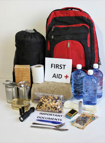 first aid kit and other essentials for a weather disaster
